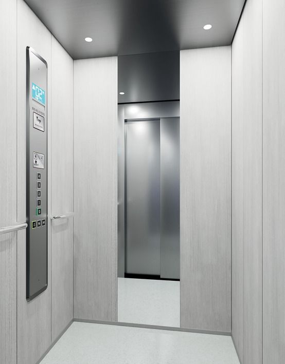 Cabina minimalista moderna blanca amb panell digital — Ascensores Skylift